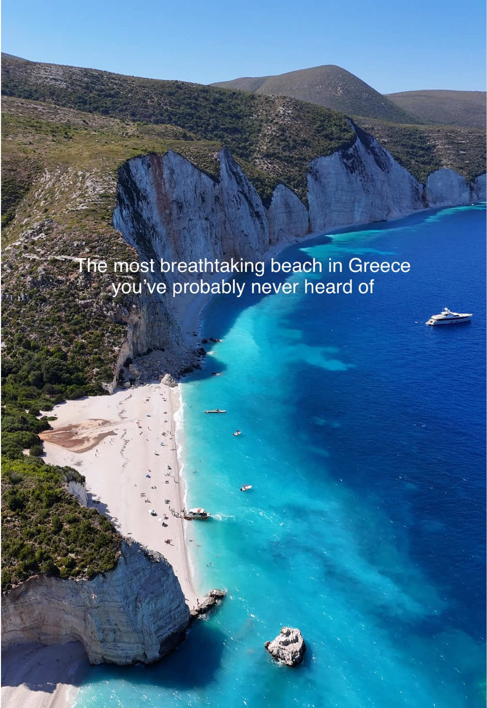 🇬🇷 How to get to Fteri Beach, Kefalonia You can easily reach this incredible beach with ink blue waters, steep white cliffs and forest all around it by taking a 10 minute water taxi from Zola Harbour on Kefalonia&rsquo;s north coast. (Day trips, self drive boat hire and hiking are also an option but we took the quickest and easiest route.) You can just turn up and book water taxi tickets on the day. A couple of companies operate out of Zola Harbour and they all charge the same prices. We travelled with @fterisluxurywatertaxi and they were fab. The price is 20 Euros per adult and 10 Euros per child for a return ticket. You book your return trip when buying the outbound ticket so if you want the most flexibility arrive early when there is more availability. There are no facilities on Fteri Beach so bring your own snacks and water and take all rubbish away with you.  I would also recommend a beach umbrella (the water taxi company lent us one!) as well as beach shoes as the beach is stony. Follow for more things to do on this incredible Greek island.